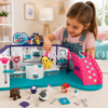 Niña jugando con Vet Squad clínica veterinaria de juguete con animales y accesorios