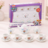 Juego de té Paw Patrol de 13 piezas con caja original, tetera, cuatro tazas, cuatro platillos, jarra y azucarero, presentado como set infantil de imitación para meriendas imaginarias.
