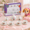 Juego de té Paw Patrol de 13 piezas presentado como regalo infantil para niña desde 3 años, con caja original, tetera, tazas, platillos, jarra, azucarero, lazo y peluche decorativo.