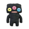 Fuggler Annoyed Alien de color negro con tres ojos y dientes humanos, en su caja original.