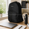 Mochila Columbia negra 25L para portátil, trabajo y universidad Mochila Columbia negra unisex 25L sobre escritorio con portátil, libreta, botella y libros, ideal para trabajo, universidad, oficina, viajes cortos y uso diario.