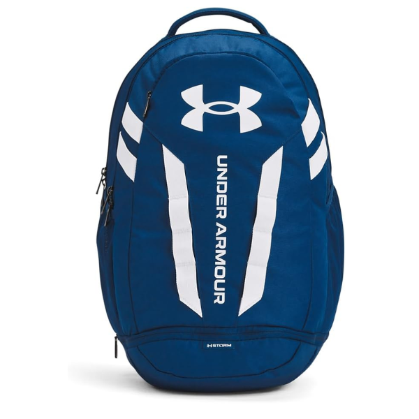 Mochila Under Armour Hustle 5.0 azul de 29 litros con diseño deportivo unisex, compartimento para portátil de hasta 15 pulgadas y bolsillo inferior para zapatillas. Modelo práctico para gimnasio, universidad, instituto, trabajo, viajes cortos y uso diario.