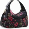 Bolso bandolera grande Desigual New London Yenes con estampado floral sobre fondo negro, ideal para uso diario.