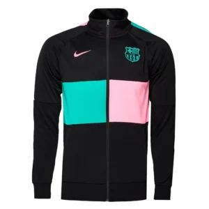 Chaqueta Nike FC Barcelona niño XS en color negro con detalles rosa y verde, cremallera completa, bolsillos con cremallera y escudo oficial del club. Prenda deportiva infantil cómoda y transpirable para fútbol o uso diario.