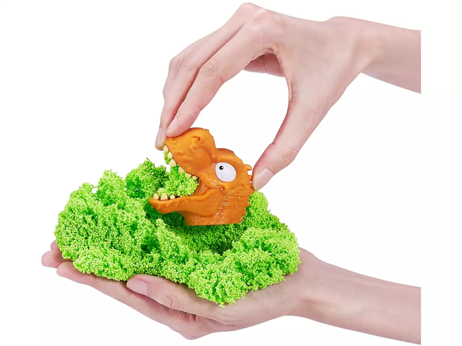 Smashers Dino Island con slime o espuma verde y cabeza de dinosaurio, mostrando el juego sensorial de excavar, descubrir piezas y crear aventuras jurásicas. Detalle del juguete de dinosaurios con slime para niños desde 5 años, ideal para juego manual, sorpresa y exploración.