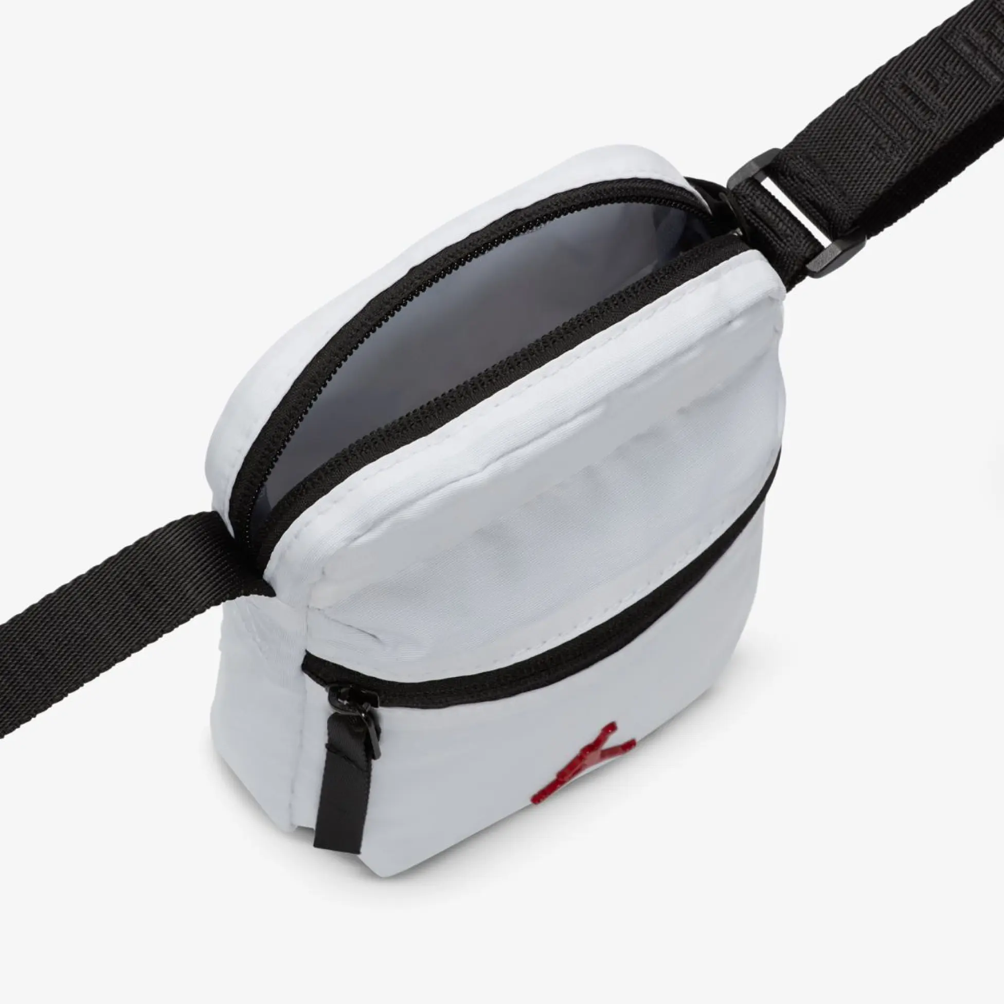 Bandolera Jordan blanca abierta con compartimento principal de cremallera