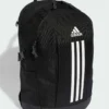 Mochila Adidas Power JZ2308 negra junto a portátil, cuadernos y material de oficina sobre un escritorio moderno