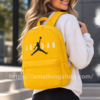 Mujer con mochila Jordan amarilla Eco Daypack 9A0833-Y3E